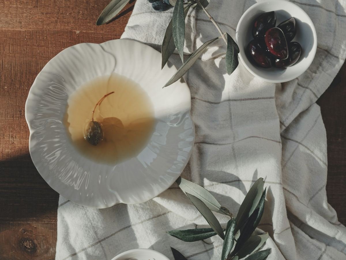 Spanish extra virgin olive oil served in a rustic Mediterranean setting